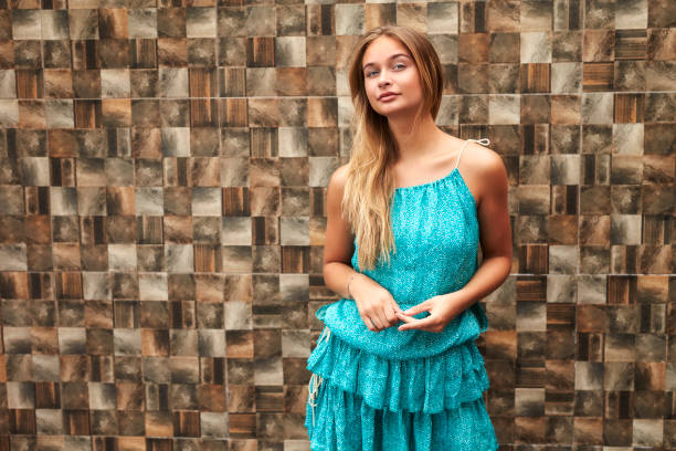 Confident woman in blue dress, portrait