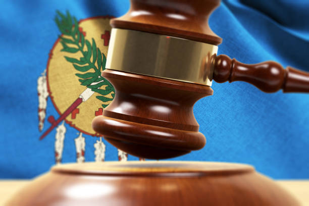 istock Wood Gavel Standing Front Of the Oklahoma State Flag Closeup 3d Render 1131111076