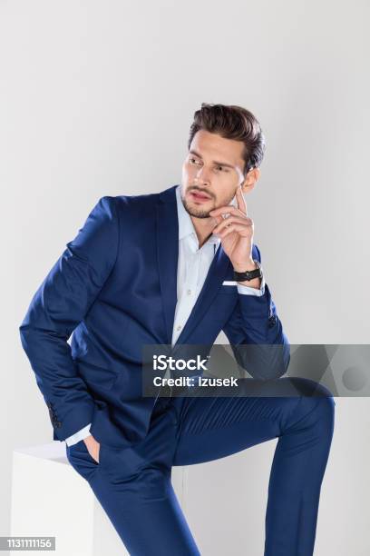 Portrait Of Good Looking Young Businessman Stock Photo - Download Image Now - Businessman, Hand On Chin, Handsome People