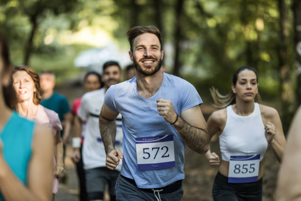istock Happy marathon runner taking a part in race in nature. 1131111484