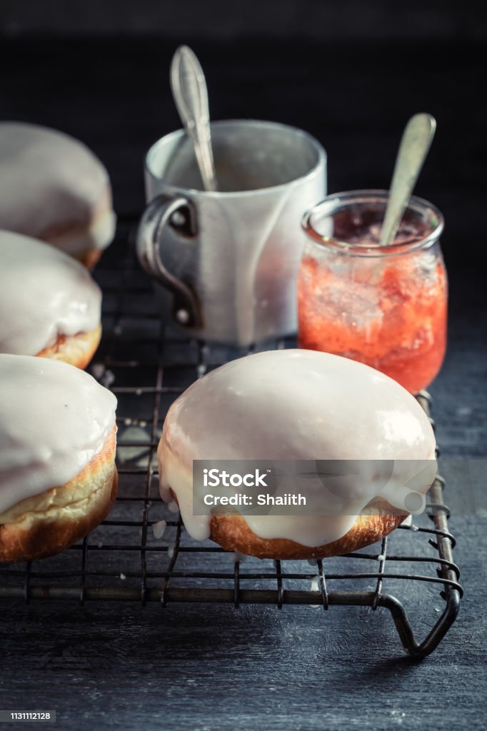 Tasty and homemade donuts with red jam Pączki Stock Photo