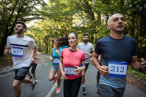 istock Large group of runners having a marathon race in nature. 1131113515