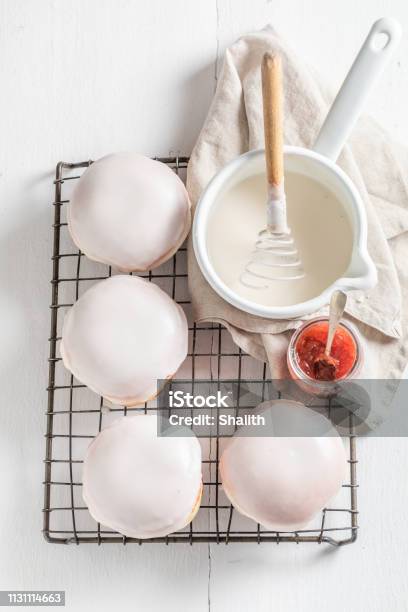 Delicious And Sweet Donuts On Cooling Grate Stock Photo - Download Image Now - Baked, Baked Pastry Item, Bakery