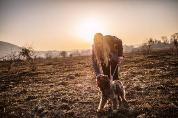 istock Woman walking with dog 1131116182