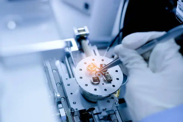 Photo of Scientist is preparation of nanomaterials for Scanning Electron Microscope (SEM) machine in laboratory