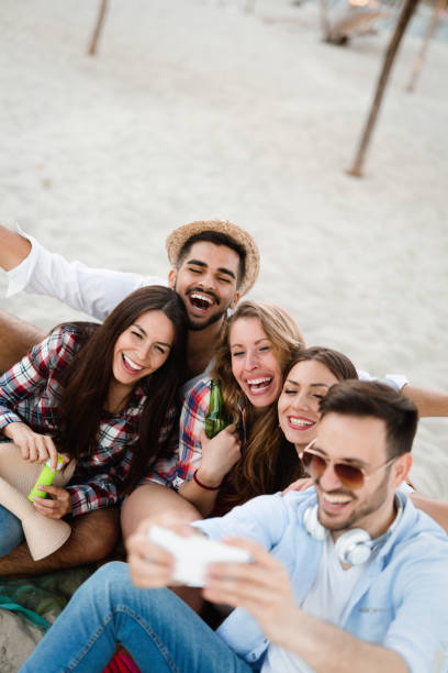 istock Happy young people taking selfies 1131118897