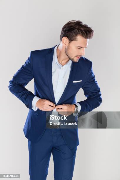 Handsome Businessman Buttoning His Jacket Stock Photo - Download Image Now - Men, Getting Dressed, Jacket