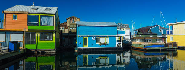 Floating Home Village Houseboats Fisherman's Wharf Inner Harbor, Victoria British Columbia Canada.Area has floating homes, boats, piers, restaurants and adventure tours stock photo