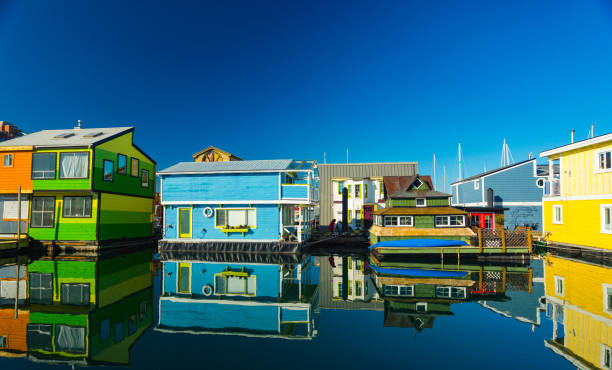 Collorful village of floathomes on bright sunny day, blue sky. Collorful village of floathomes on bright sunny day, blue sky. houseboat photos stock pictures, royalty-free photos & images