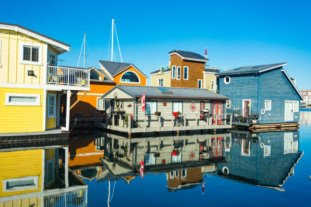 Collorful village of floathomes on bright sunny day, blue sky. Collorful village of floathomes on bright sunny day, blue sky. collorful stock pictures, royalty-free photos & images