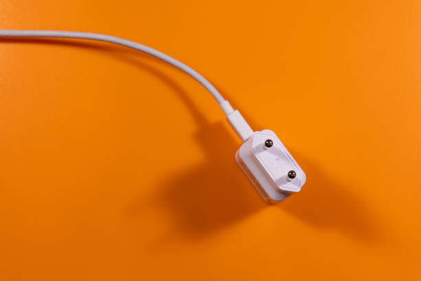 istock universal charger in white on a orange background 1131123040