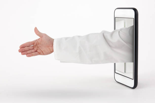 Doctor handshake with arm coming out of the phone Doctor handshake with arm coming out of the phone farmacia stock pictures, royalty-free photos & images