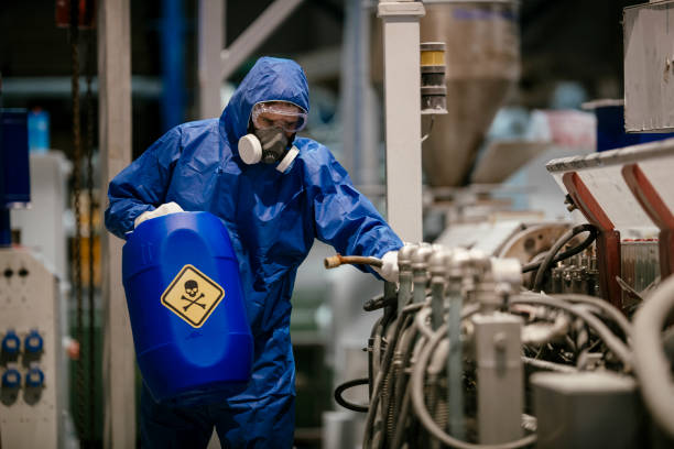 istock Factory worker wearing gas mask and radioactive protection suit 1131123258