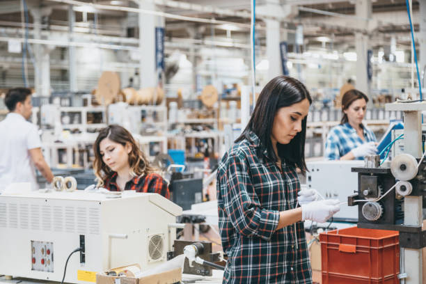 istock Group of workers working on the production line in factory 1131123375