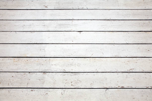 istock Weathered wooden planks painted white background 1131124990