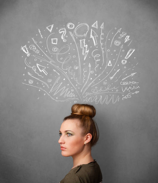 istock Young woman thinking with sketched arrows above her head 1131125054