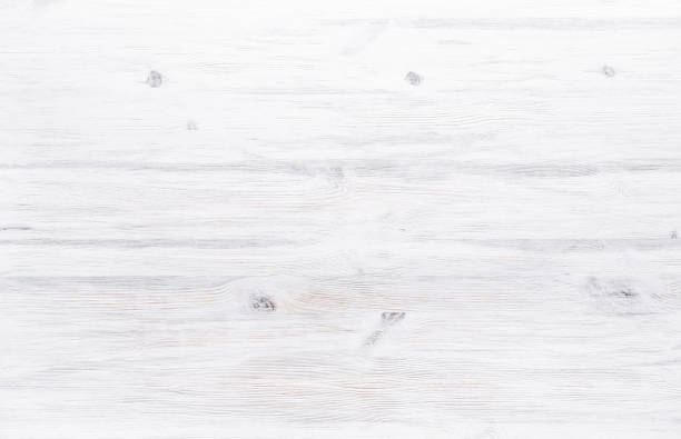 istock White painted wooden desk background tabletop, rustic light blank clear plank wood texture timber board surface minimal empty clean simple table with copy free space for text, top view 1131127906