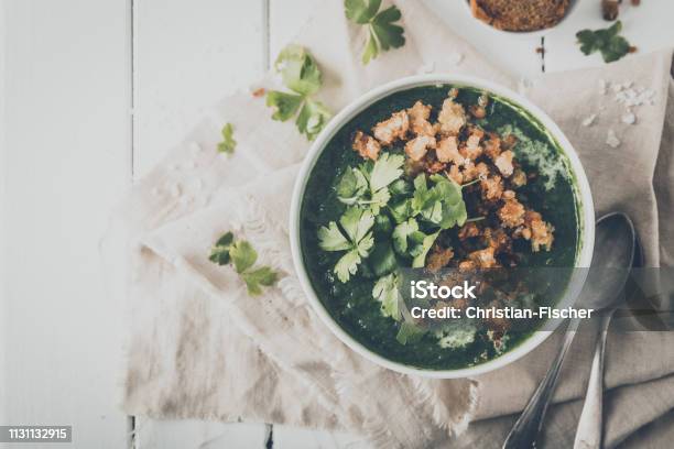 Creamy Spinach Soup With Fresh Croutons And Parsley Top View Stock Photo - Download Image Now