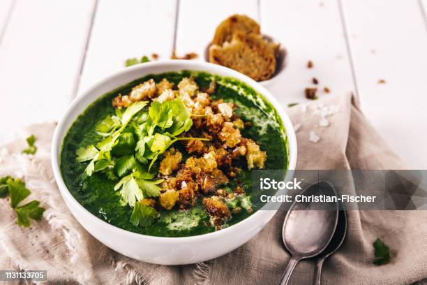 Creamy Spinach Soup With Fresh Croutons And Parsley Top View Stock Photo - Download Image Now