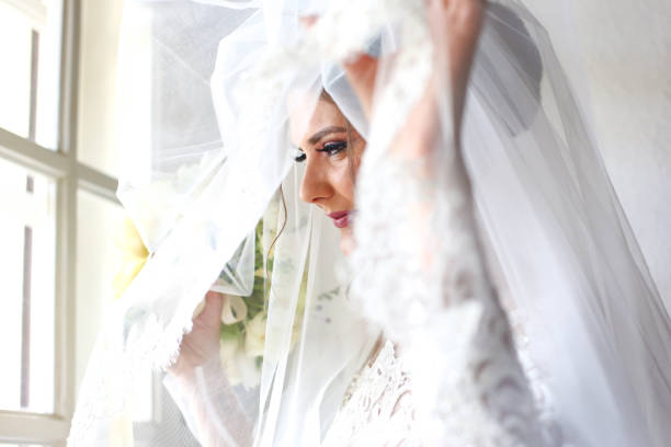 istock Elegant beautiful wedding bride posing near great window arch 1131133785