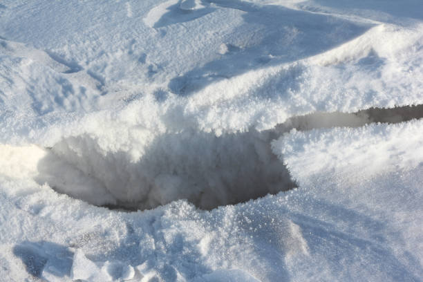 istock Crack on the snow river in the spring 1131135989