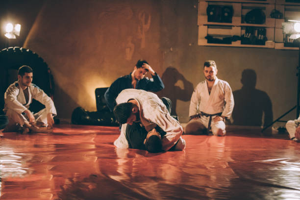 istock Two men fight on martial arts training 1131137409