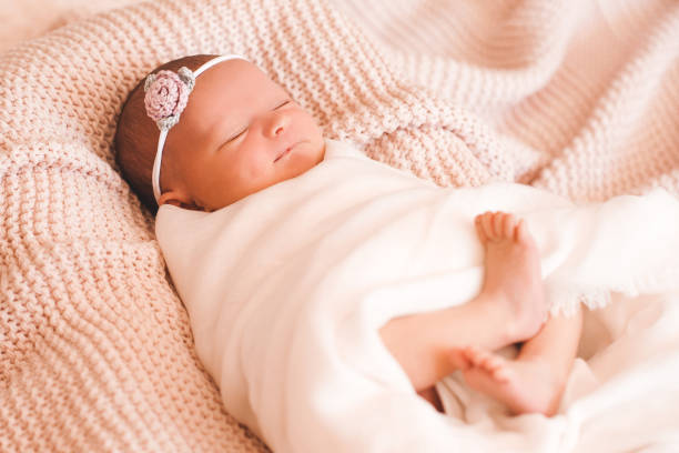istock Baby girl in bed 1131140129