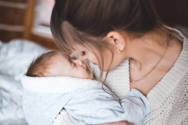 istock Mother with baby on hands 1131140219