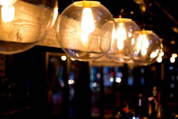 istock round glass lamp with lit bulb 1131140633