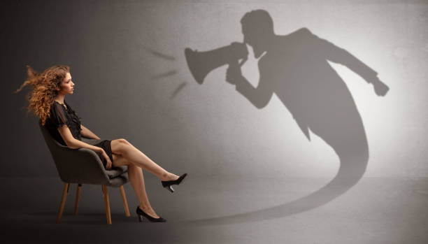 istock Dark shadow yelling to elegant lady 1131140853