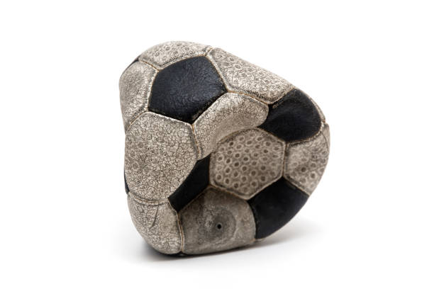 istock Old football ball isolated on white 1131141044