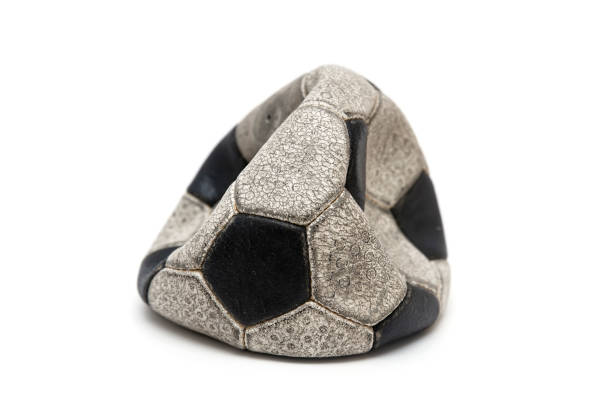 Old football leather ball on a white background