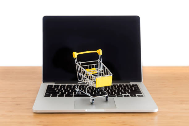 istock mini supermarket trolley on laptop 1131141111