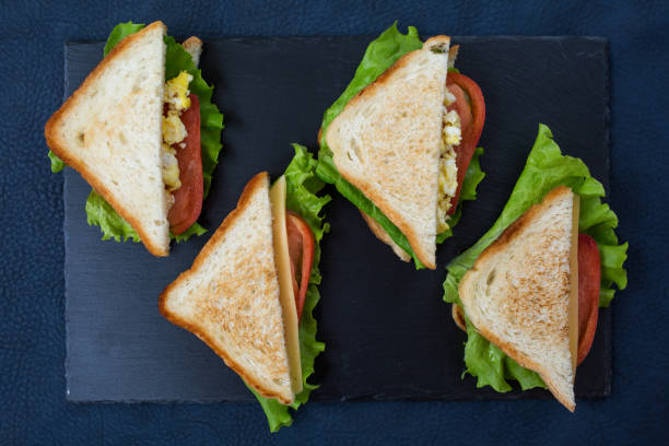 istock Delicious sandwiches: scramble egg, tomatoes and cheese. Light and healthy snack. 1131142476