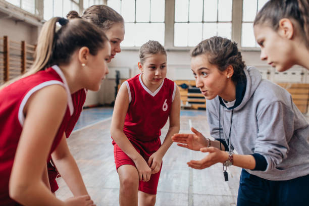 istock Basketball coach supporting her players on time out 1131143687
