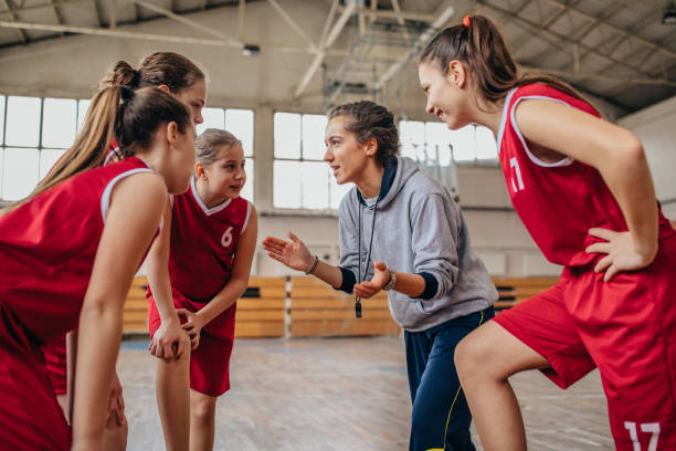 istock Basketball coach supporting players on time out 1131143752