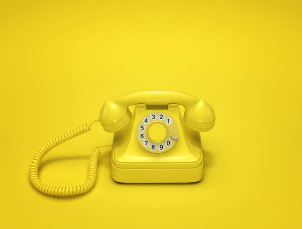 istock Yellow vintage phone on yellow background 1131144226