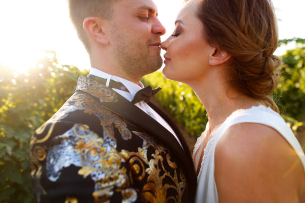 istock A couple on their wedding day posing in a vineyard at sunset 1131144344