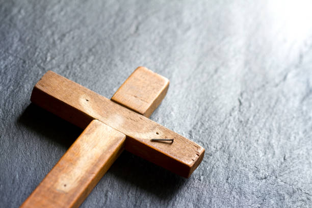 istock Empty cross with shadow of Jesus Christ abstract resurrection easter background concept 1131145514