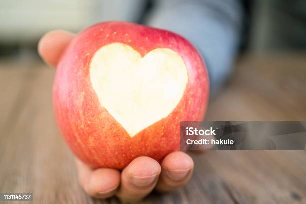 Hand Holding Apple Pie With Heart Shape Concept Of Love Stock Photo - Download Image Now