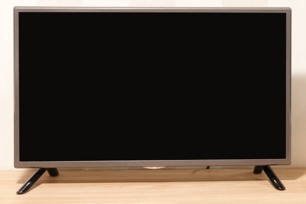 istock Blank black screen TV monitor on shelf 1131145852