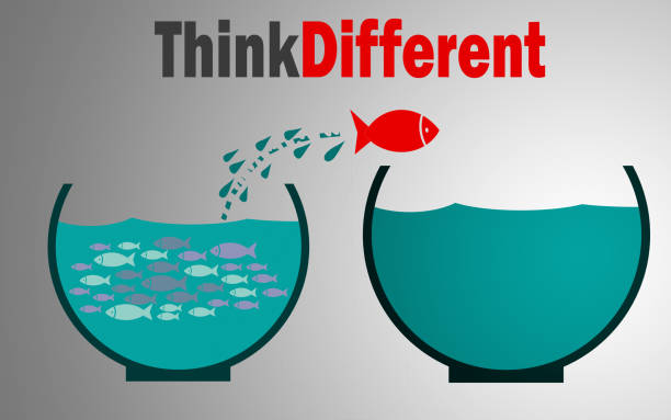 istock Think different, Fish jumping outside the aquarium 1131147654