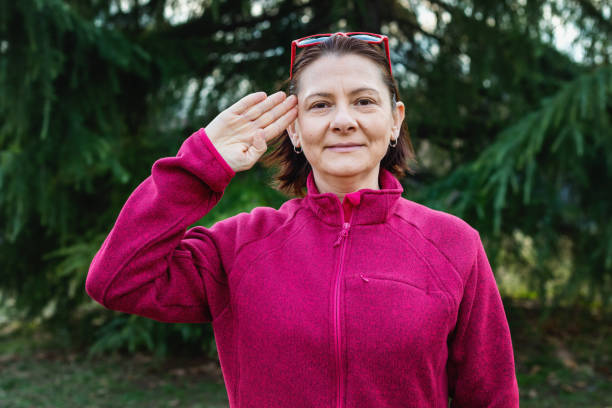 istock Woman using American sign language - hand gesture hello 1131148333