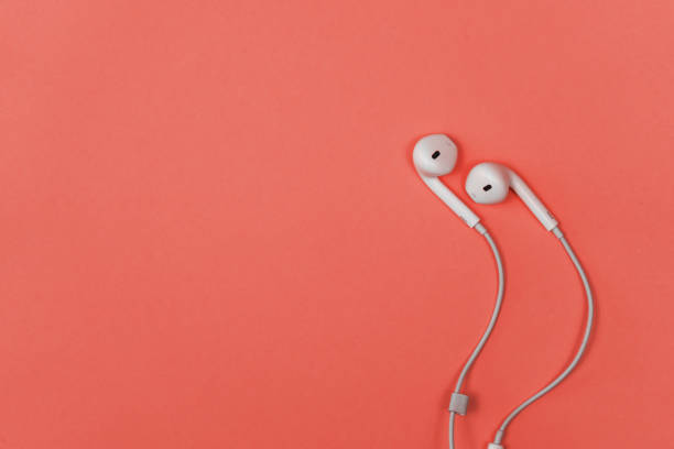 istock Headphones on a coral background 1131148954
