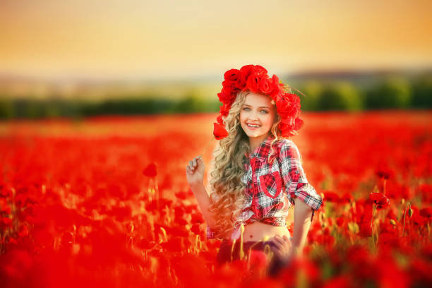 portrait of a girl on the street with a wreath of poppy flowers on the head - village traditional festival agricultural fair school carnival imagens e fotografias de stock