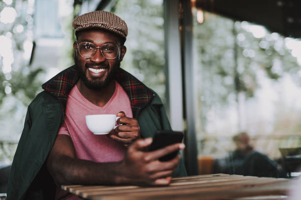 istock Young cheerful afro-american male sit in cafe 1131150109