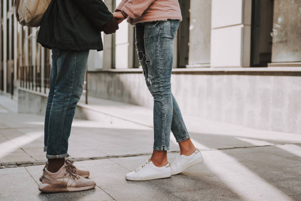istock Young male and female lovers holding hands 1131150145