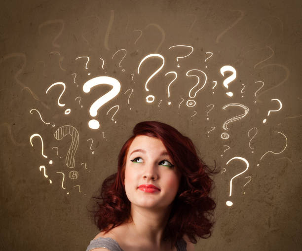 istock girl with question mark symbols around her head 1131150925