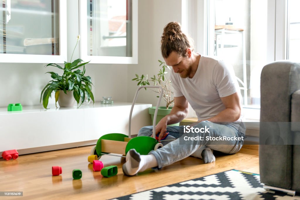Father and son playing Young family with little baby boy 12-17 Months Stock Photo