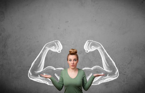 istock Young woman with strong muscled arms 1131151745